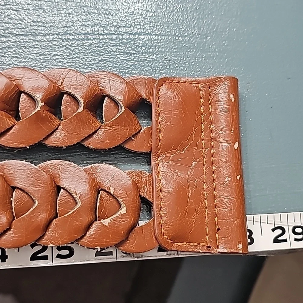 Stretch wide belt. There is some wear but picked it‎ up because it is cut…